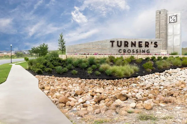 an aerial view of a house with a big yard