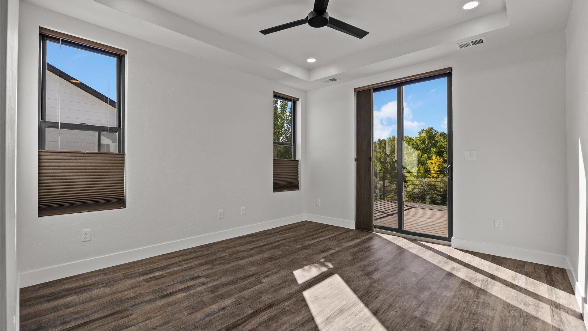 745 Fairhaven Road Palisade, CO 81526 - Photo 15 of 33 a view of an empty room with a window and wooden floor