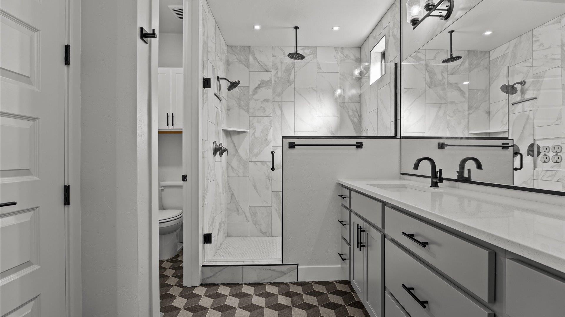 745 Fairhaven Road Palisade, CO 81526 - Photo 18 of 33 a bathroom with a shower sink and mirror