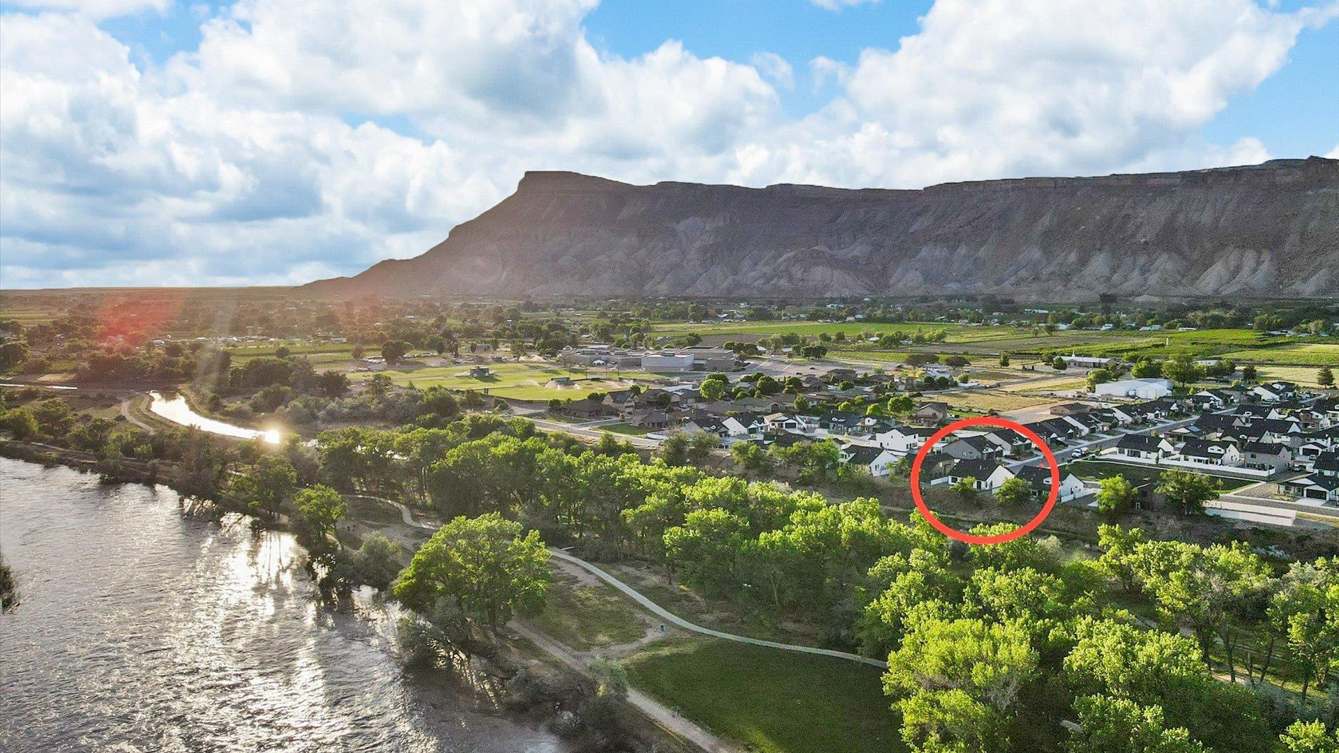 745 Fairhaven Road Palisade, CO 81526 - Photo 2 of 33 a view of a lake with mountains in the background