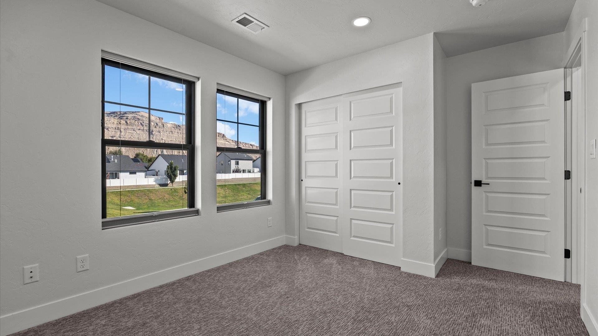 745 Fairhaven Road Palisade, CO 81526 - Photo 24 of 33 wooden floor and window in an empty room