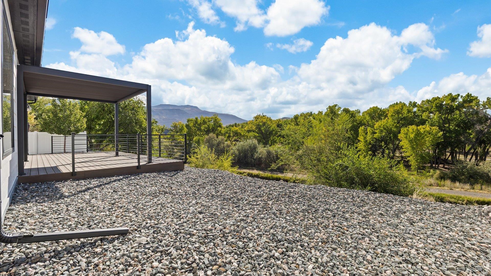 745 Fairhaven Road Palisade, CO 81526 - Photo 30 of 33 a view of a garden with a building in the background