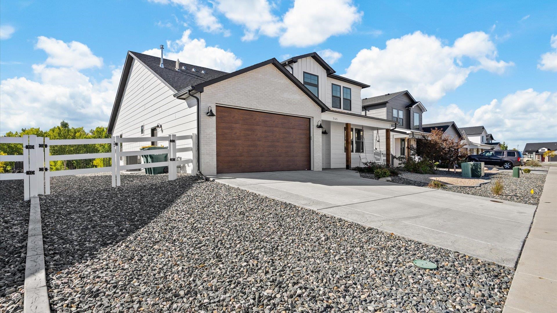 745 Fairhaven Road Palisade, CO 81526 - Photo 5 of 33 a front view of a house with a yard and garage
