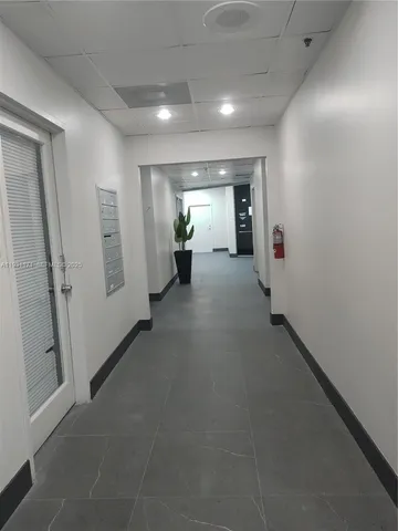 a view of a chairs and tables in a patio