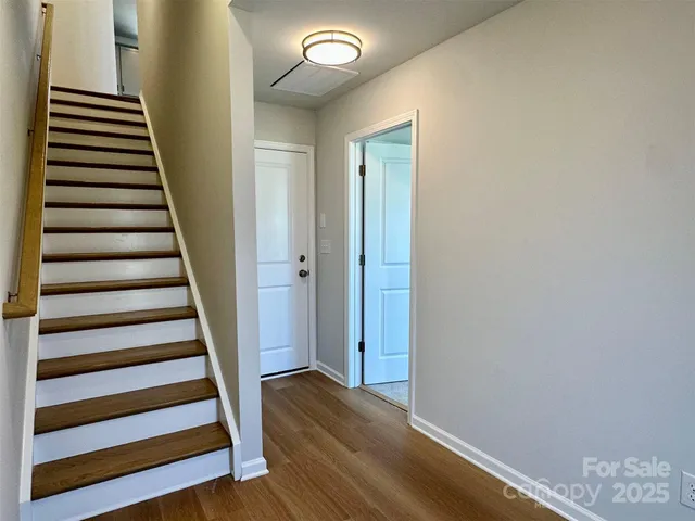 a view of entryway with wooden floor