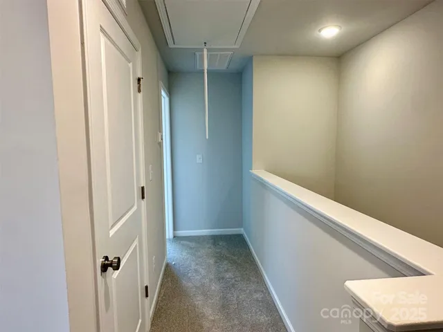 a view of hallway with stairs