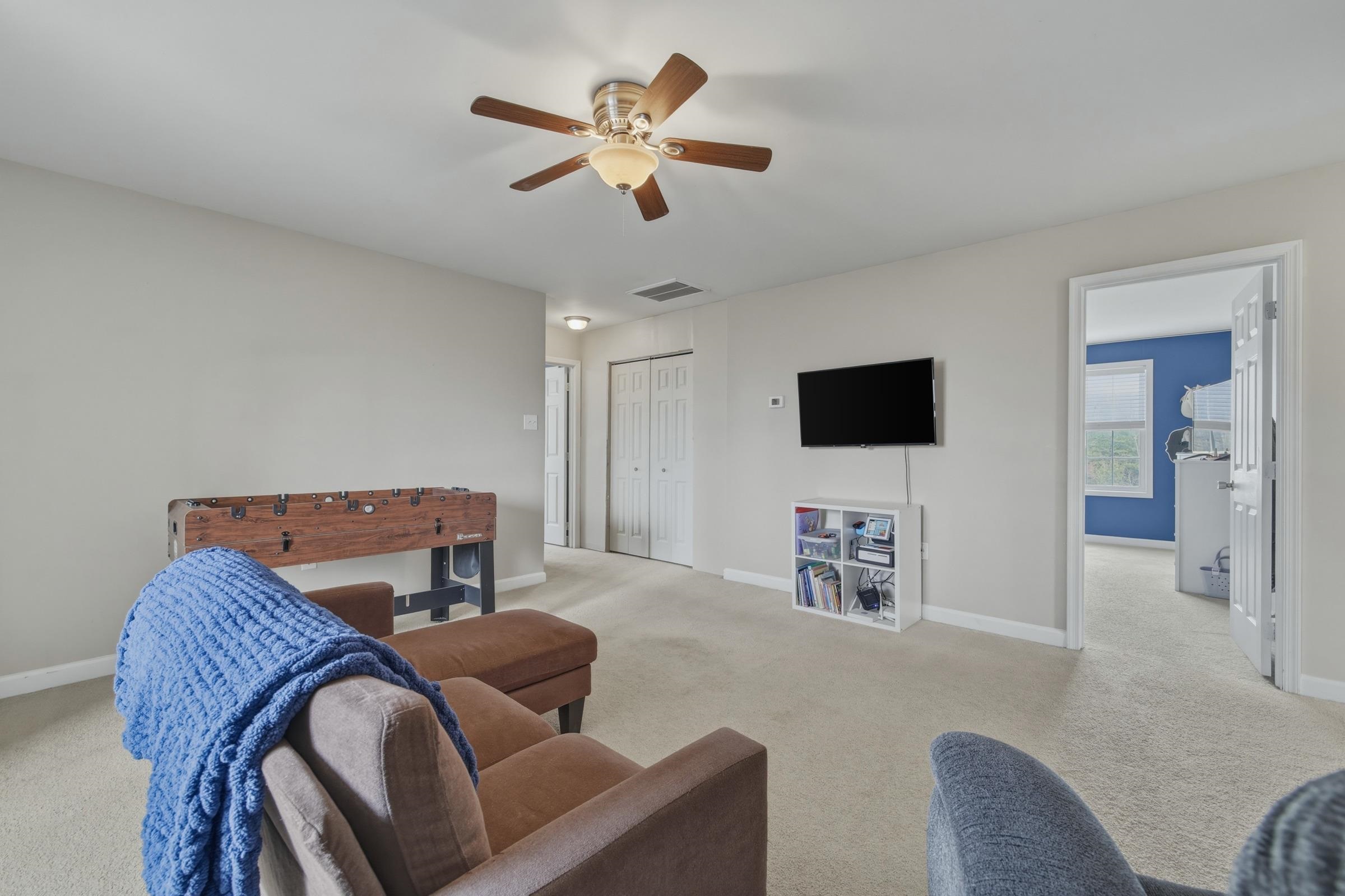 257 Hunter Road Maurertown, VA 22644 - Photo 27 of 61 a living room with furniture and a flat screen tv