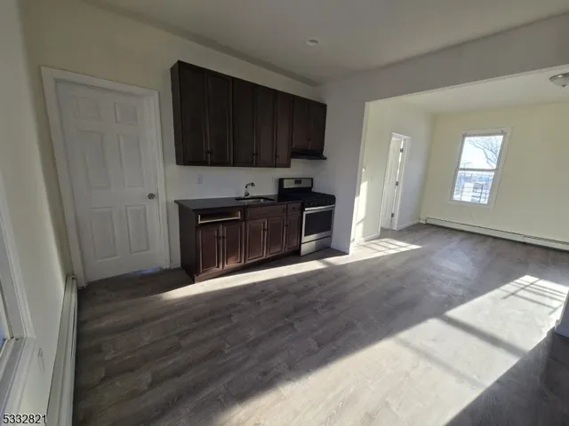 a view of a kitchen with a sink cabinets and a window
