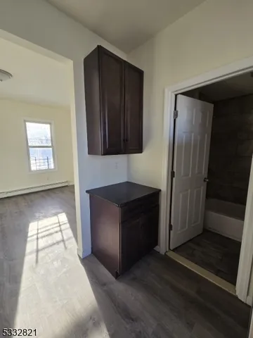 a kitchen with stainless steel appliances granite countertop a refrigerator and a stove