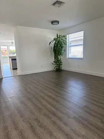 a bathroom with a sink vanity and toilet