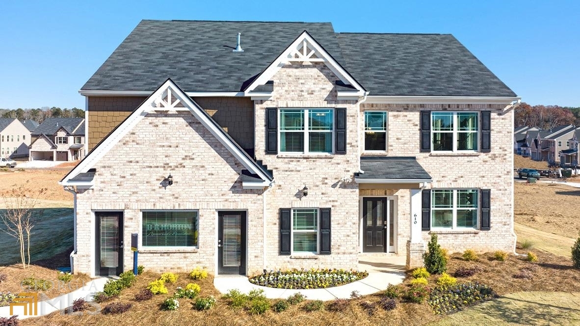 925 Eldridge Road, Unit 81 Hampton, GA 30228 - Photo 1 of 1 a view of a white house with a large windows