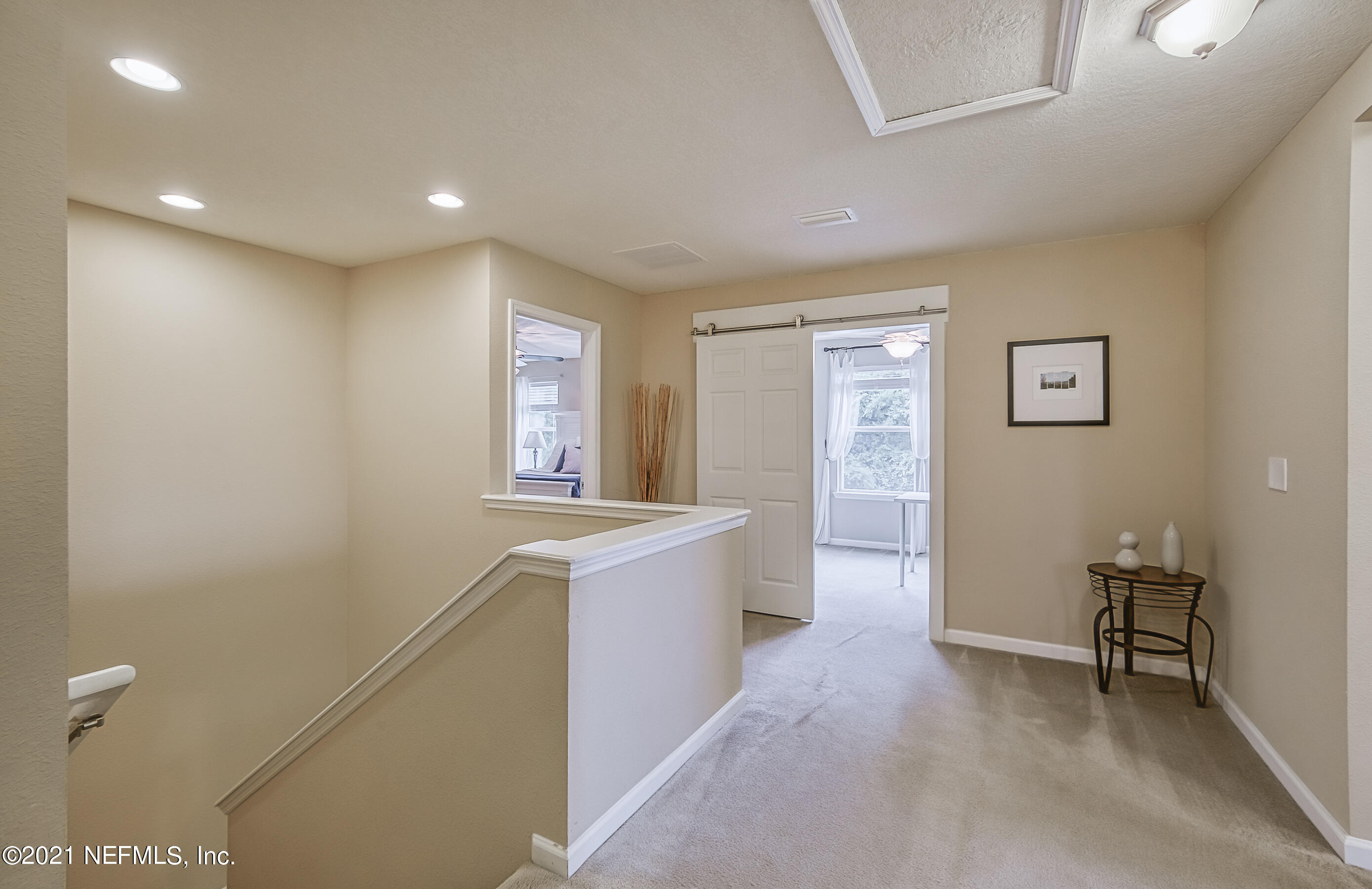 9686 Wexford Chase Road Jacksonville, FL 32257 - Photo 17 of 45 Upstairs loft with barn door to office