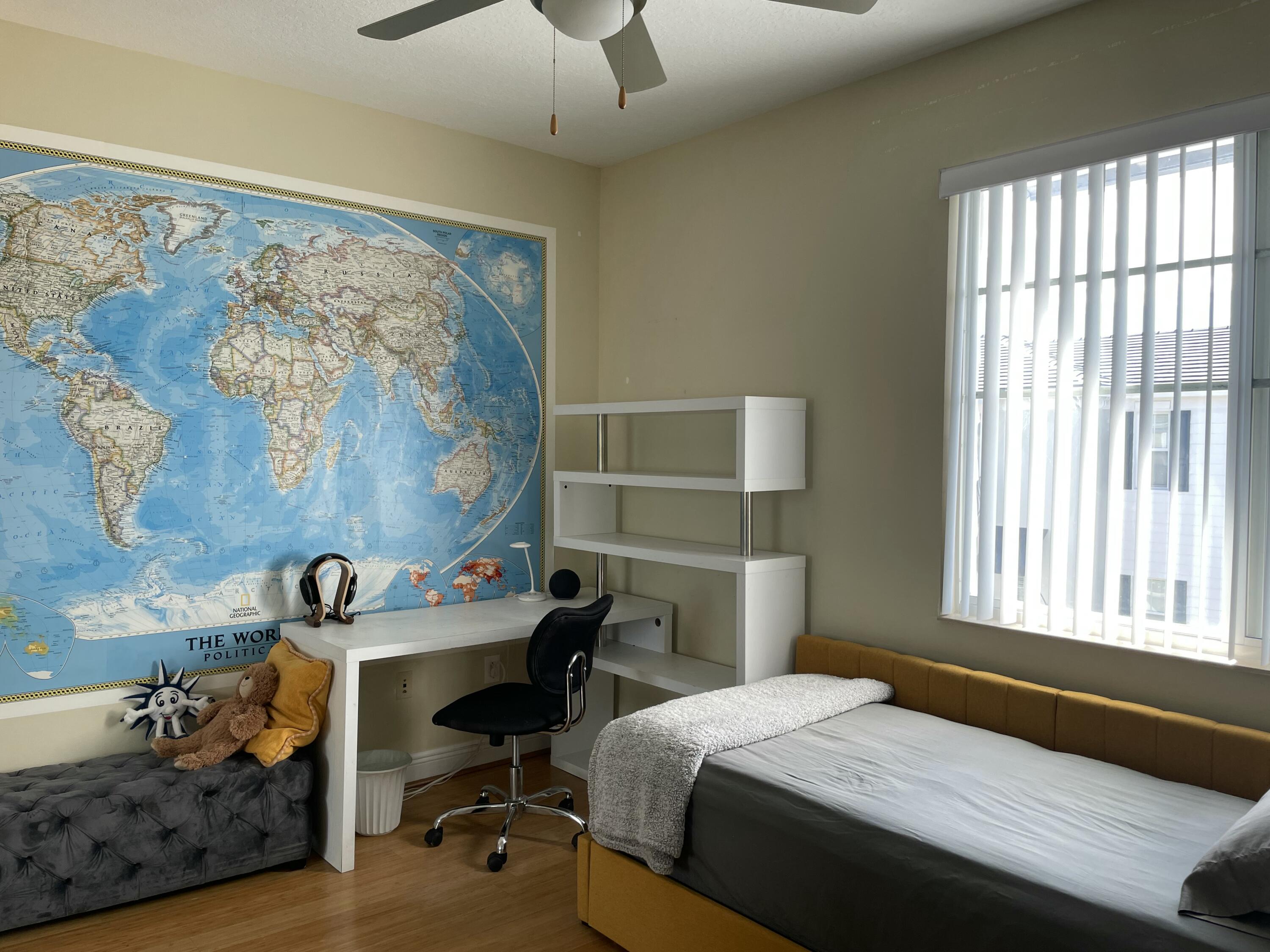 552 North West 39th Circle Boca Raton, FL 33431 - Photo 13 of 33 a bedroom with a bed and a window