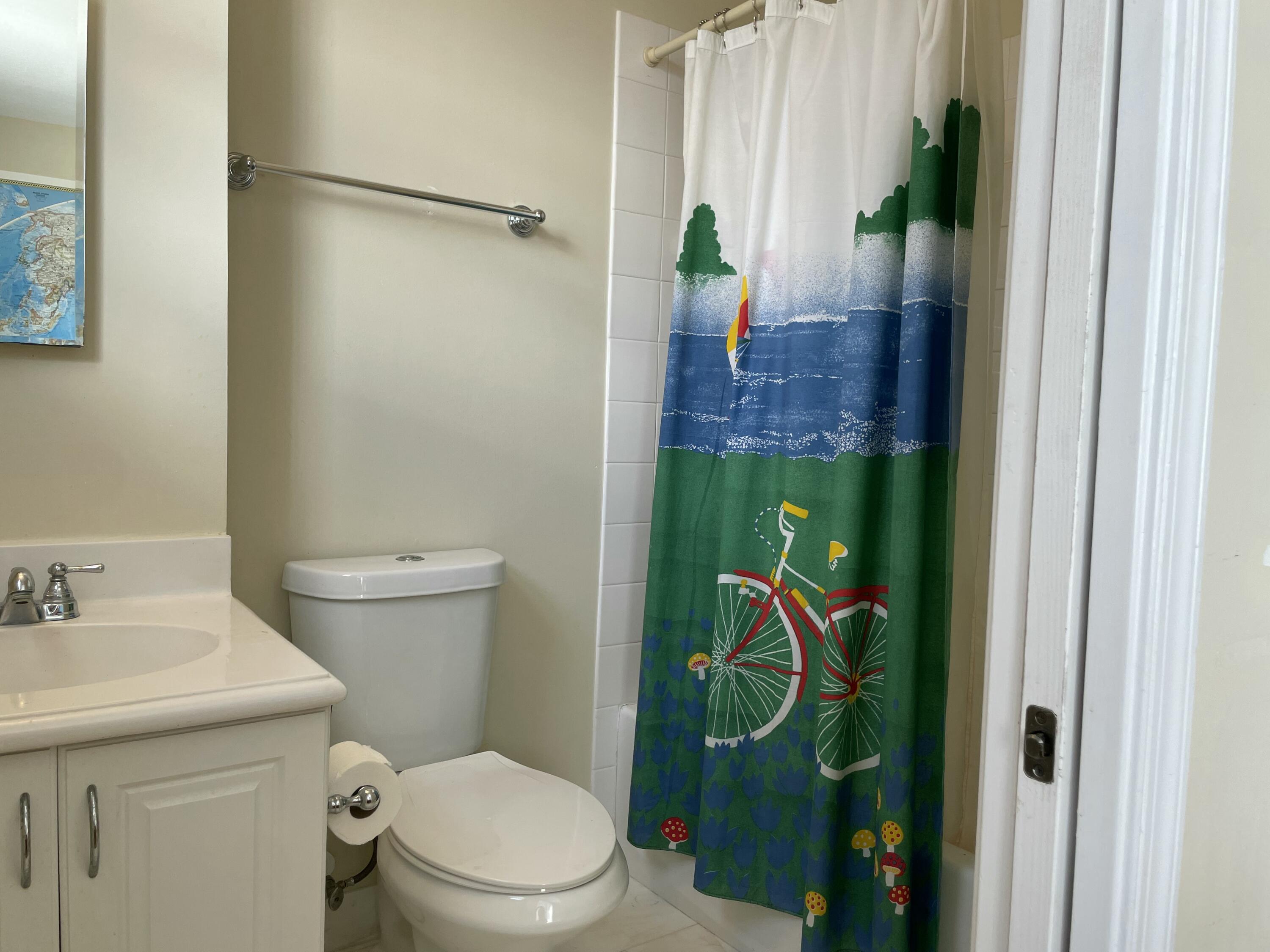 552 North West 39th Circle Boca Raton, FL 33431 - Photo 15 of 33 a bathroom with a toilet a sink and shower