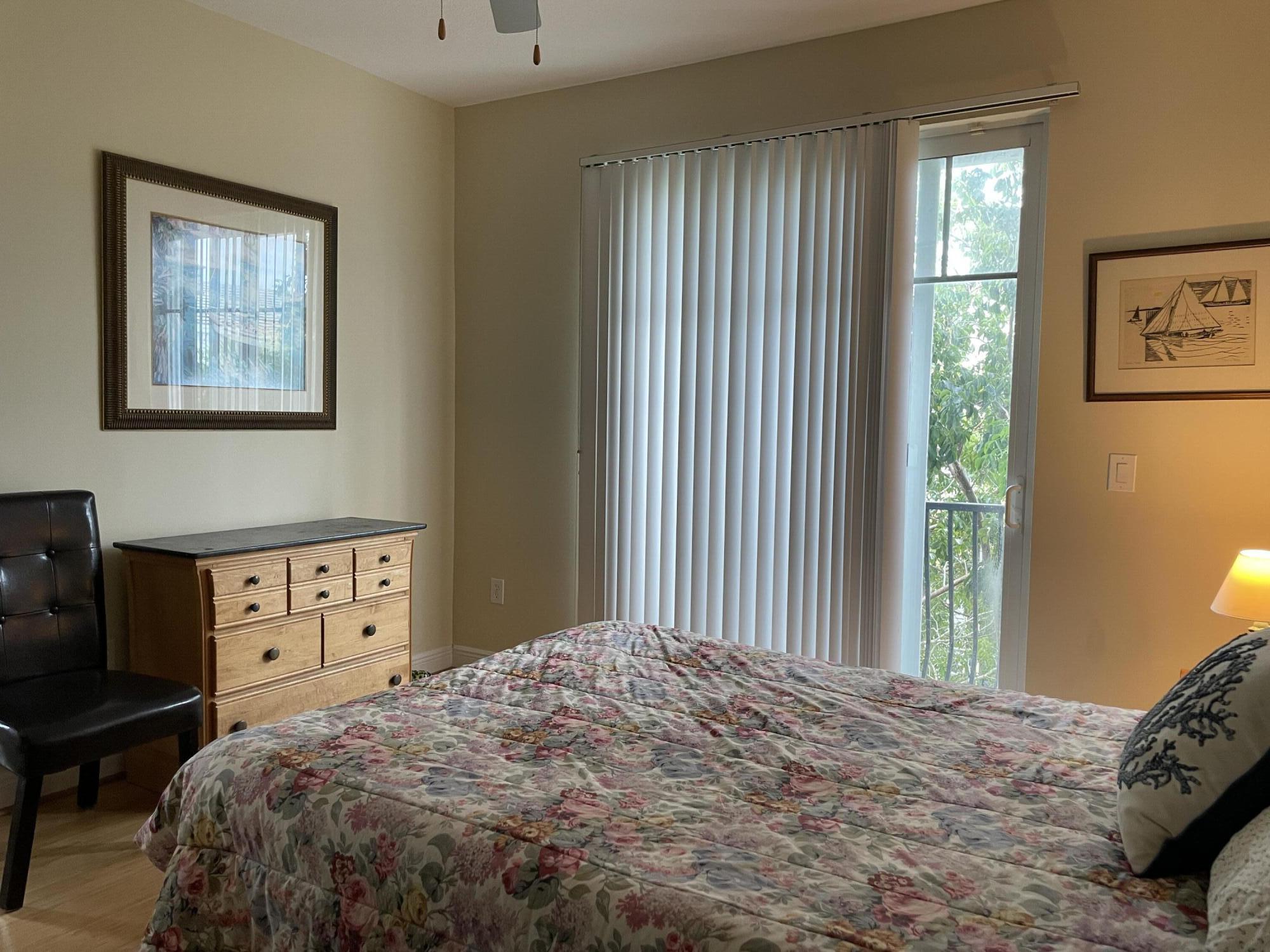 552 North West 39th Circle Boca Raton, FL 33431 - Photo 16 of 33 a bedroom with a bed and a window