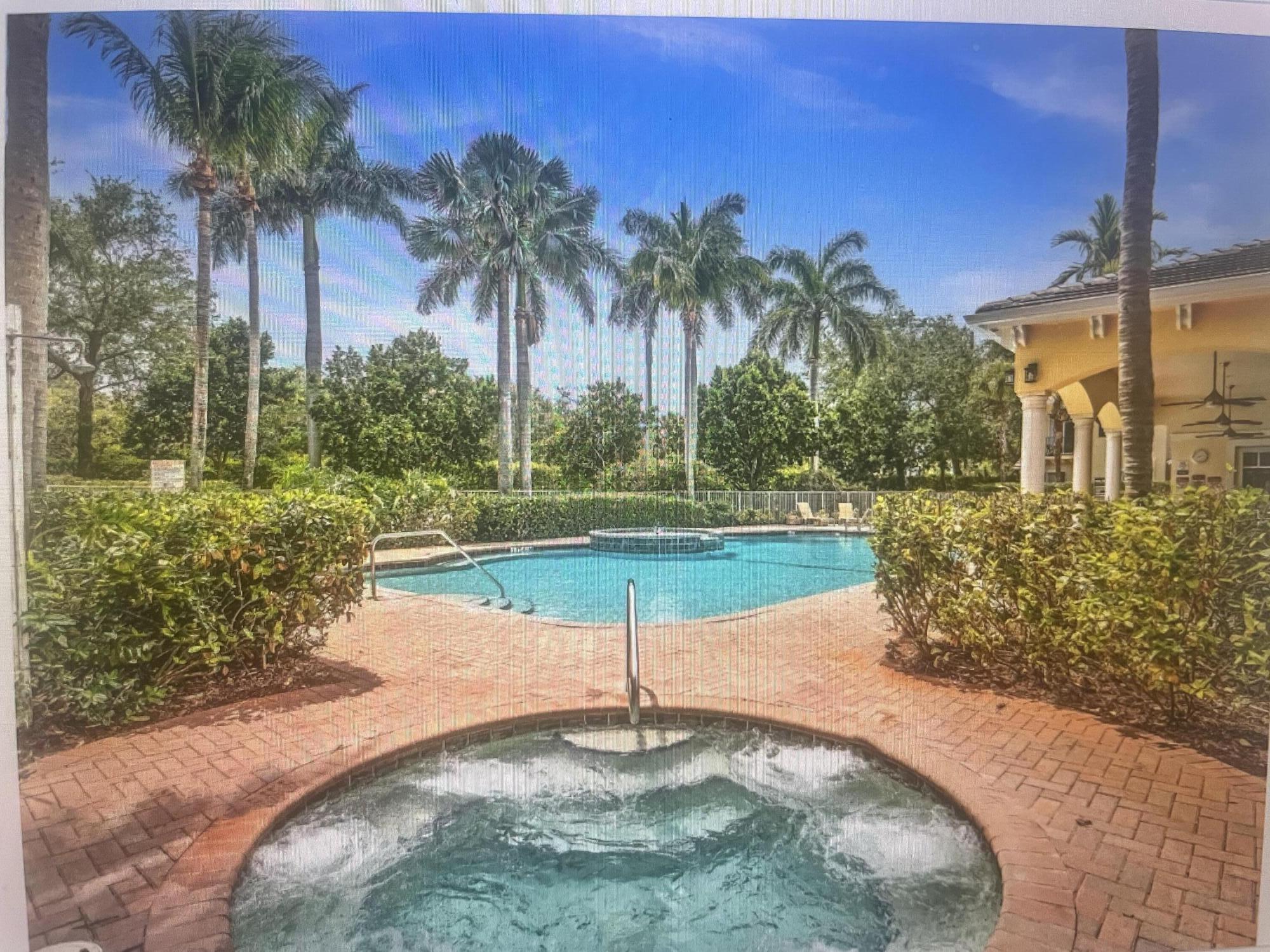 552 North West 39th Circle Boca Raton, FL 33431 - Photo 30 of 33 a swimming pool with outdoor seating and yard