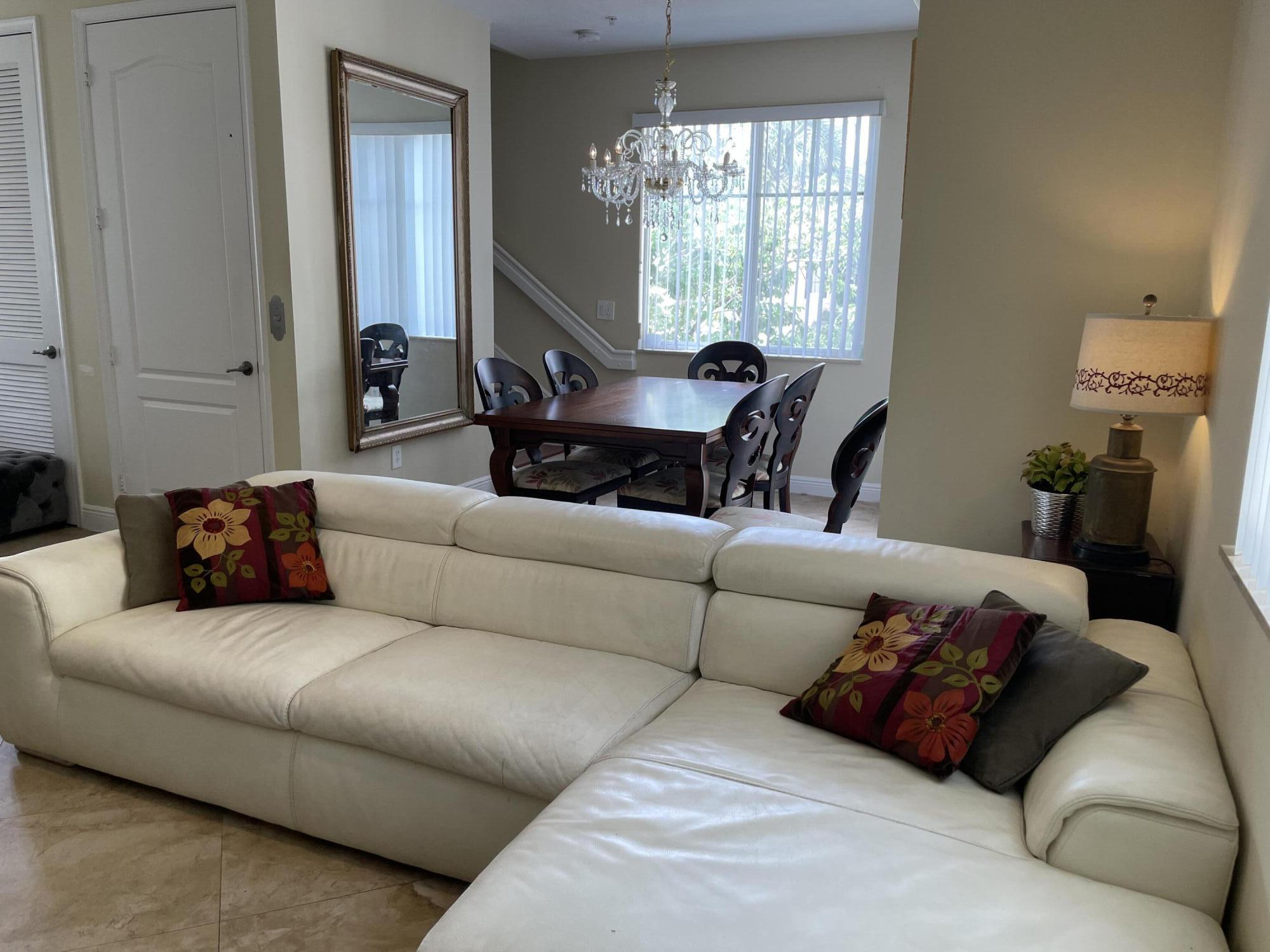 552 North West 39th Circle Boca Raton, FL 33431 - Photo 7 of 33 a living room with furniture and a large window