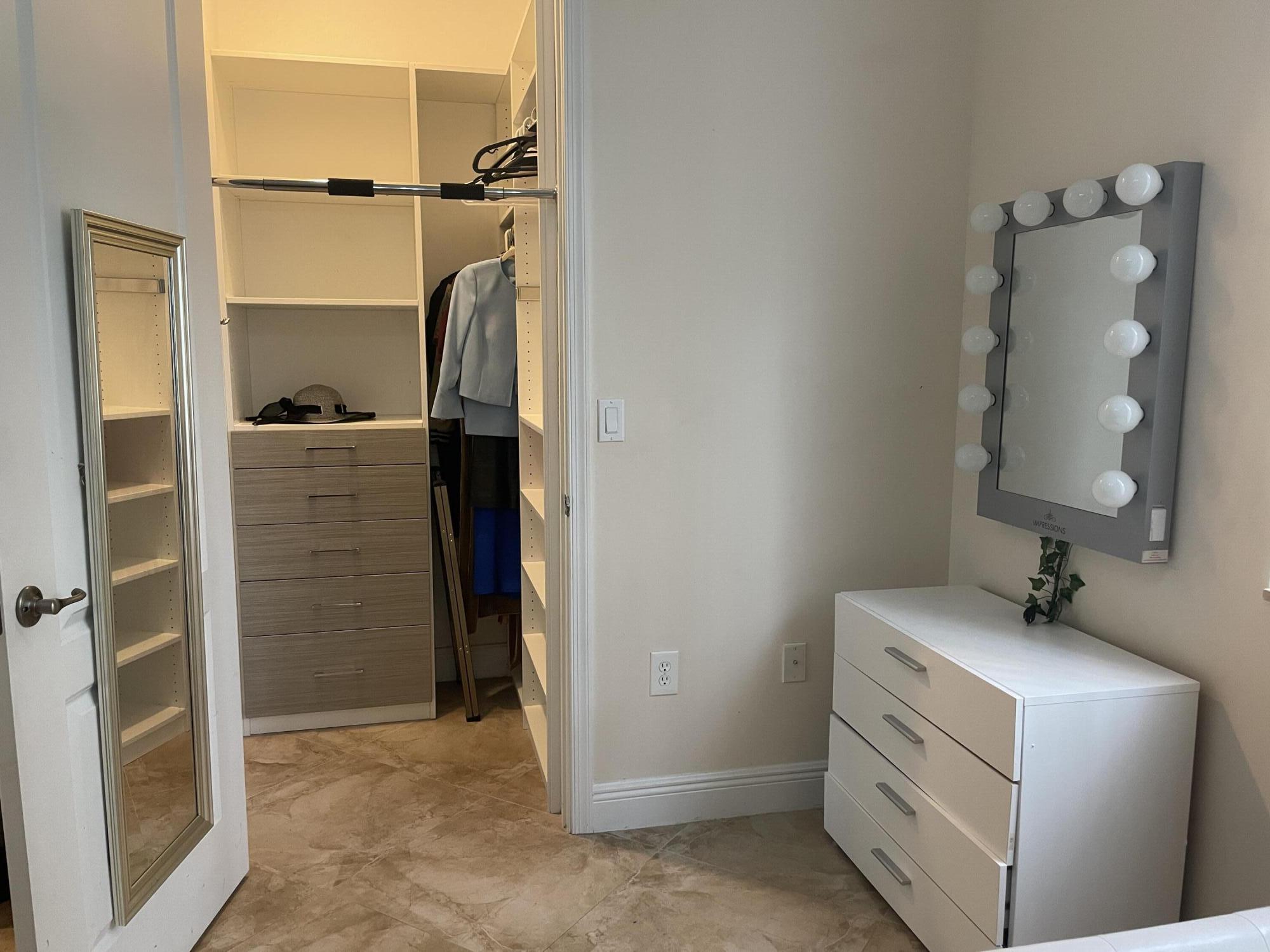 552 North West 39th Circle Boca Raton, FL 33431 - Photo 10 of 33 a bathroom with a shower sink and mirror