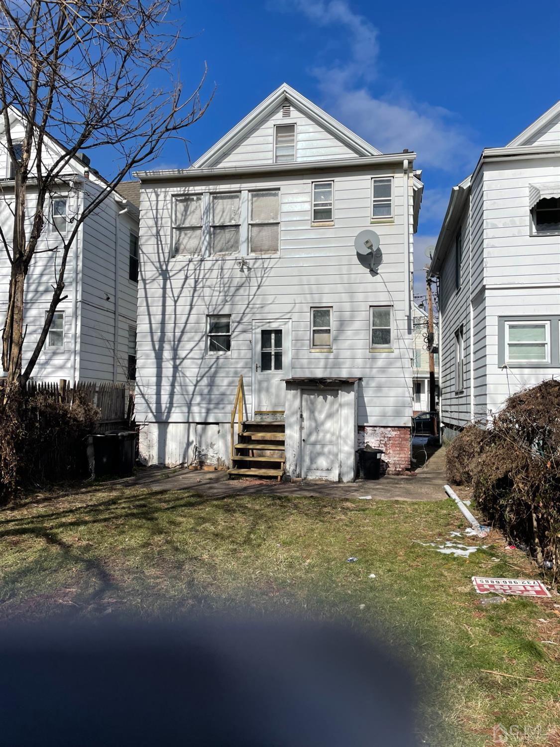 34 Delafield Street New Brunswick, NJ 08901 - Photo 2 of 4 a view of a house with a yard