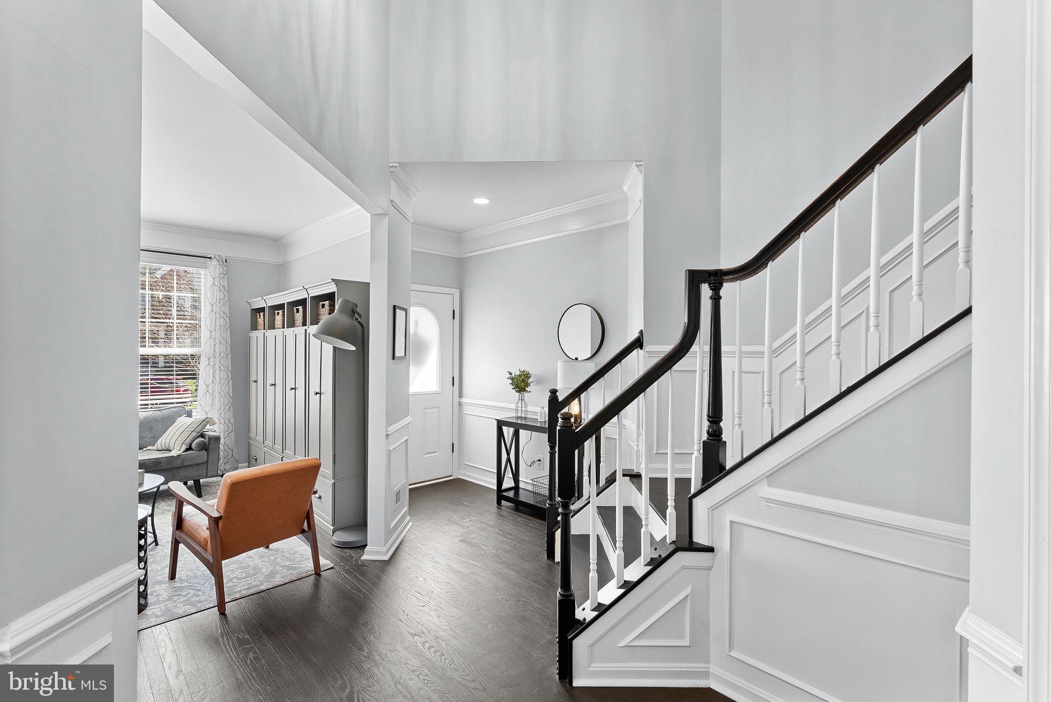 23388 Minerva Drive Brambleton, VA 20148 - Photo 2 of 57 a view of staircase with furniture and a window