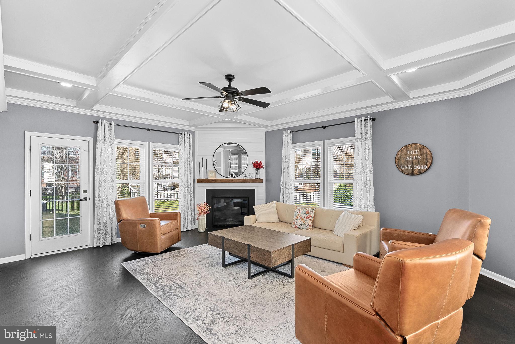 23388 Minerva Drive Brambleton, VA 20148 - Photo 21 of 57 a living room with furniture and a fireplace