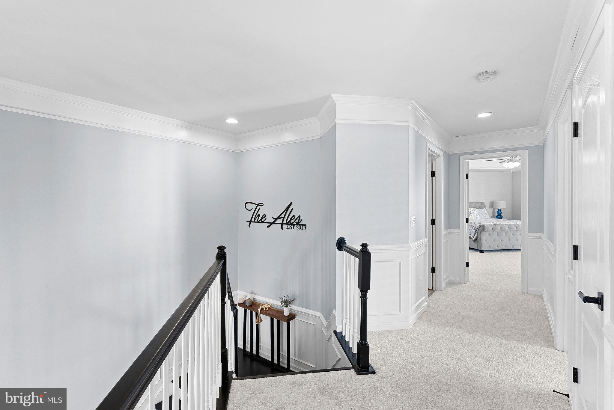 23388 Minerva Drive Brambleton, VA 20148 - Photo 24 of 57 a view of a hallway with a livingroom and a bathroom