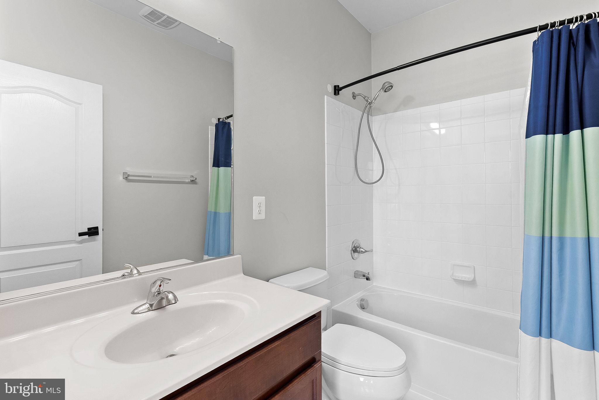 23388 Minerva Drive Brambleton, VA 20148 - Photo 35 of 57 a bathroom with a sink toilet and shower