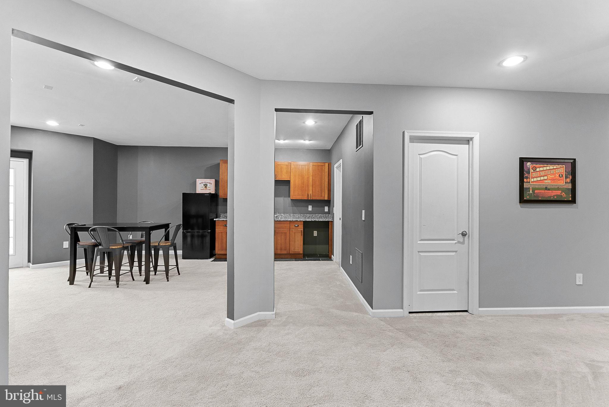 23388 Minerva Drive Brambleton, VA 20148 - Photo 39 of 57 an entryway with a dining room and chandelier