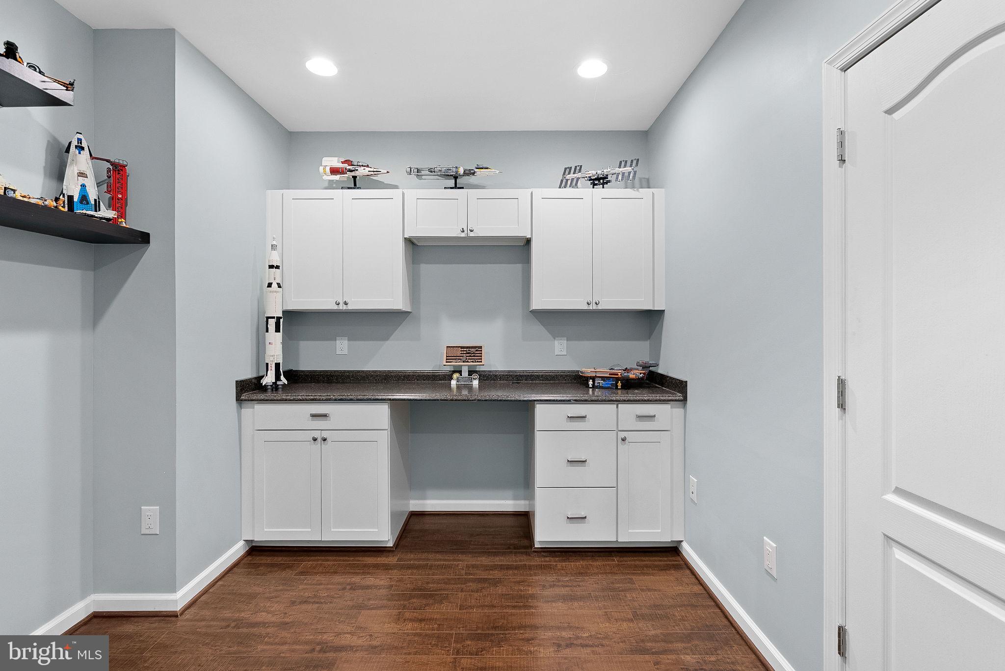 23388 Minerva Drive Brambleton, VA 20148 - Photo 47 of 57 a kitchen with stainless steel appliances granite countertop a stove and a sink