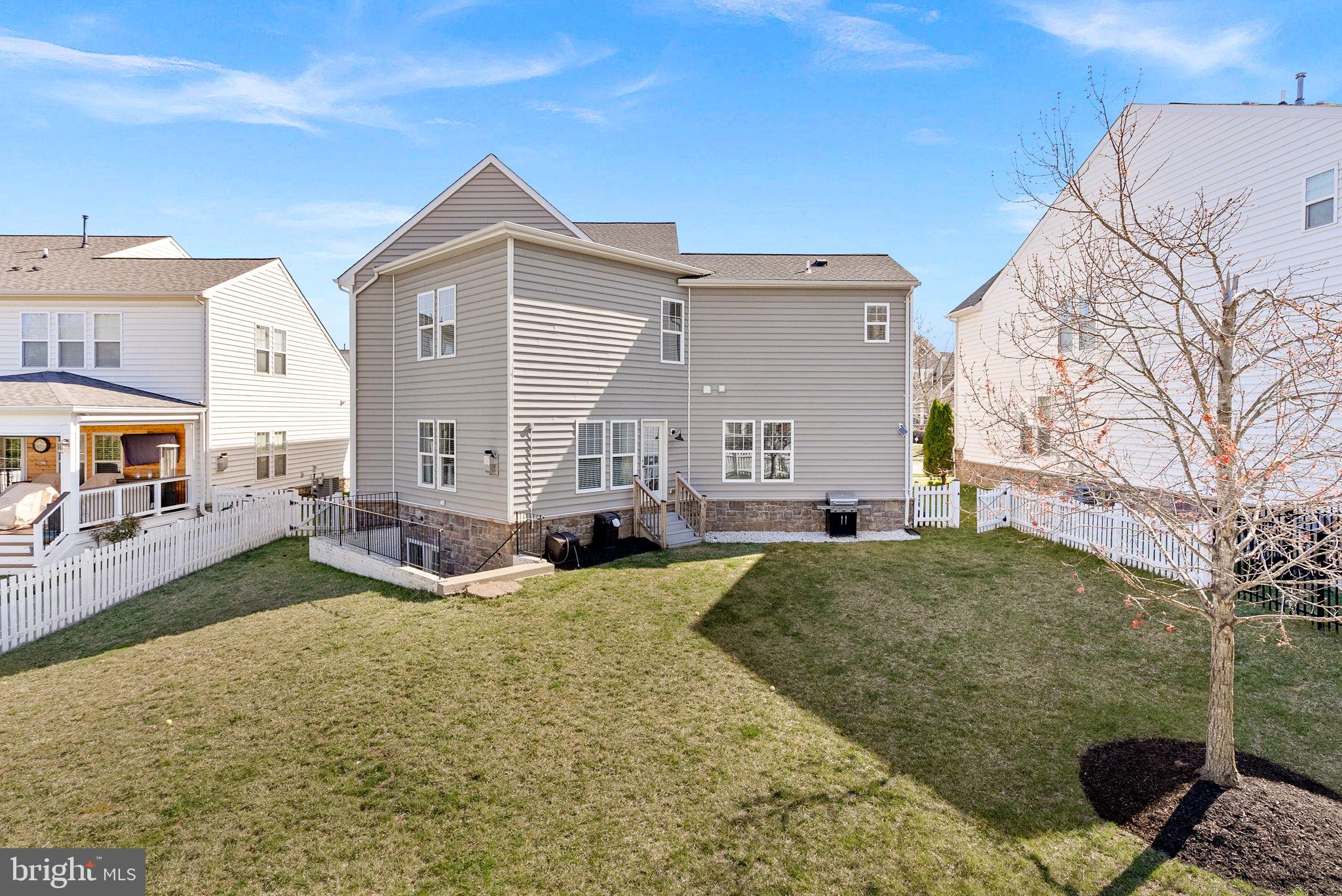 23388 Minerva Drive Brambleton, VA 20148 - Photo 50 of 57 a view of house with yard tub and seating space