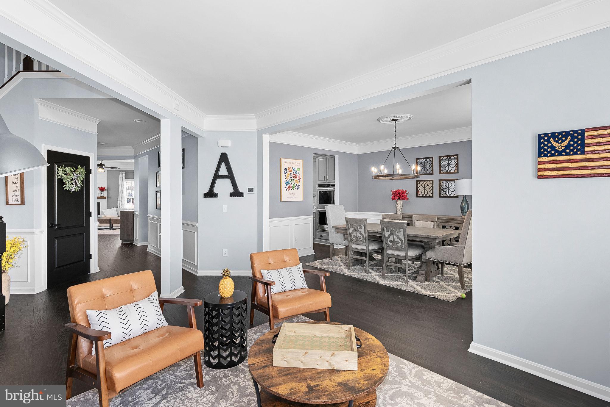 23388 Minerva Drive Brambleton, VA 20148 - Photo 6 of 57 a living room with furniture and wooden floor