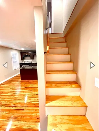 a view of kitchen and wooden floor