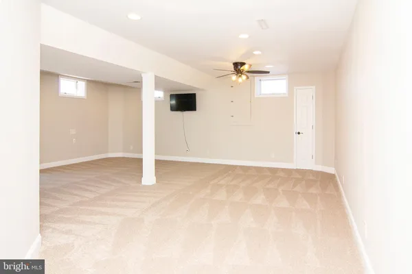 a view of a livingroom with a kitchen