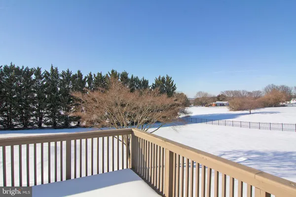 a view of a balcony with wooden floor