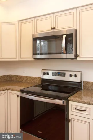 a kitchen with a stove and a microwave