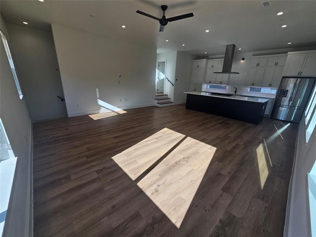 2139 Mail Avenue, Unit 101 Dallas, TX 75235 - Photo 7 of 21 Open Living room to kitchen urn wirh ceiling fan and tall ceilings