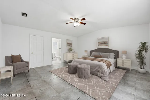 a bathroom with a shower sink vanity and toilet