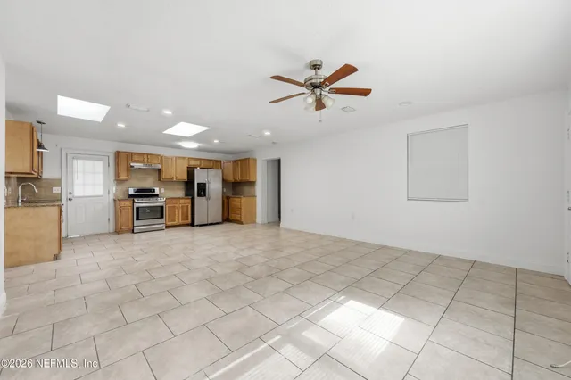 a view of an empty room and window