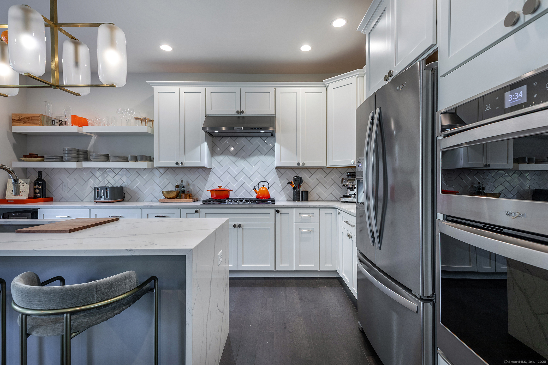 175 Ridgewood Drive, Unit 175 Middlebury, CT 06762 - Photo 11 of 21 a kitchen with stainless steel appliances a sink stove refrigerator and cabinets