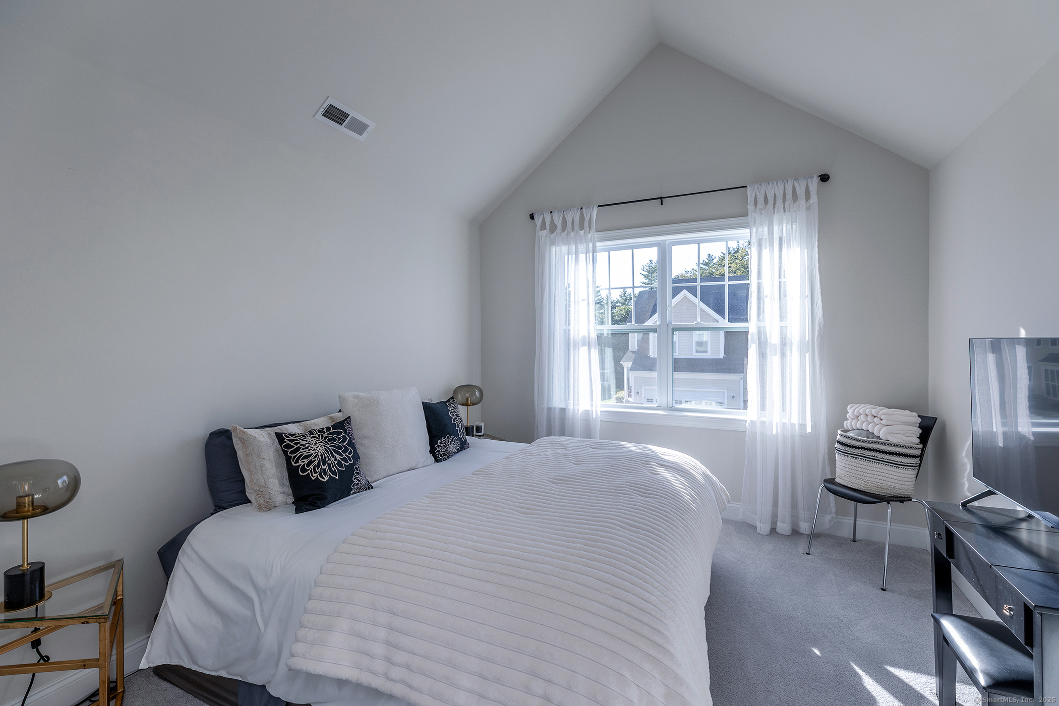 175 Ridgewood Drive, Unit 175 Middlebury, CT 06762 - Photo 15 of 21 a bedroom with bed and window