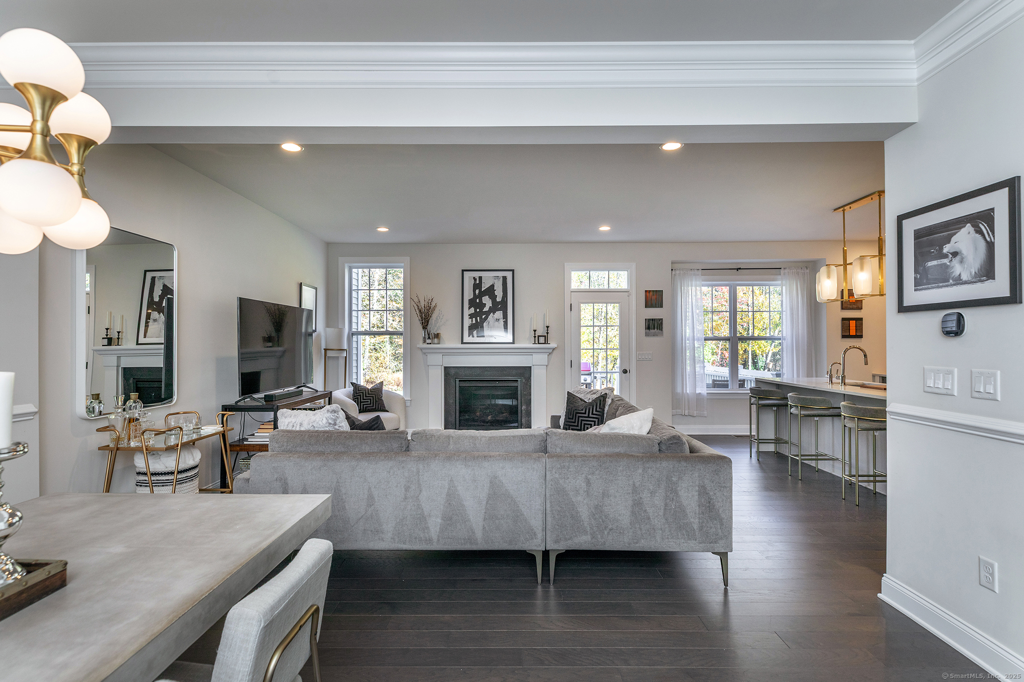 175 Ridgewood Drive, Unit 175 Middlebury, CT 06762 - Photo 5 of 21 a living room with furniture and a fireplace