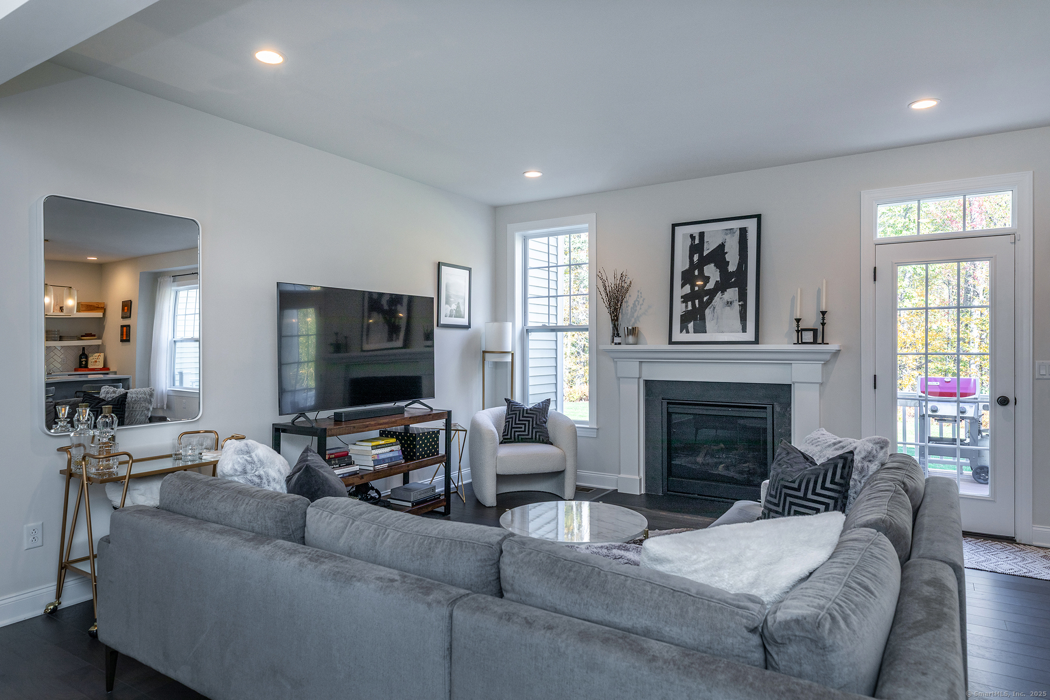 175 Ridgewood Drive, Unit 175 Middlebury, CT 06762 - Photo 6 of 21 a living room with furniture and a fireplace