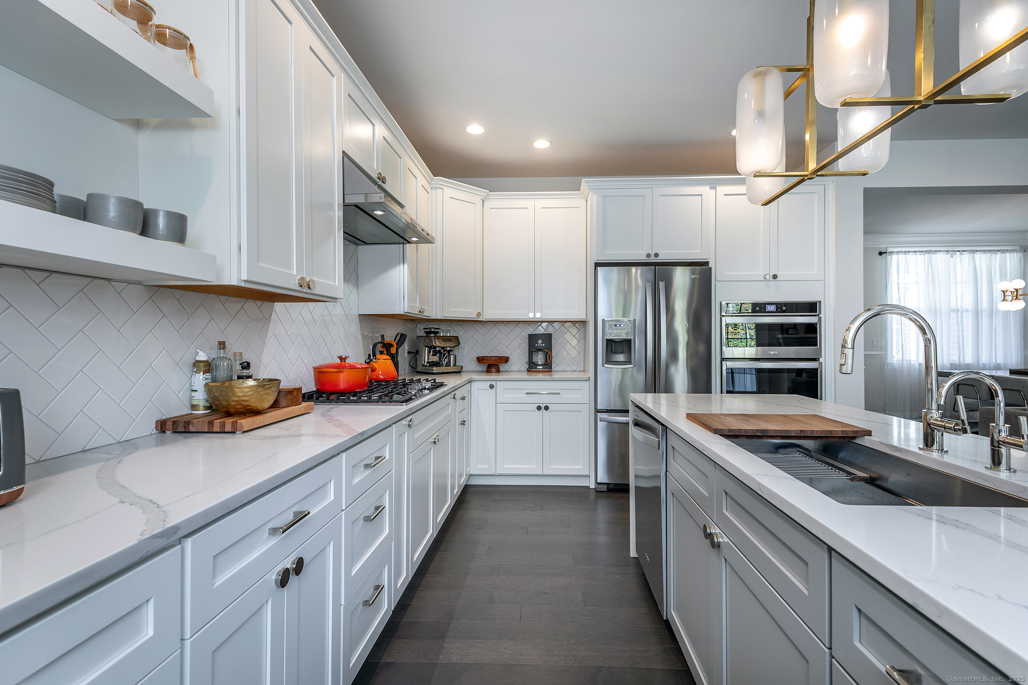 175 Ridgewood Drive, Unit 175 Middlebury, CT 06762 - Photo 10 of 21 a kitchen with stainless steel appliances granite countertop a sink stove and refrigerator