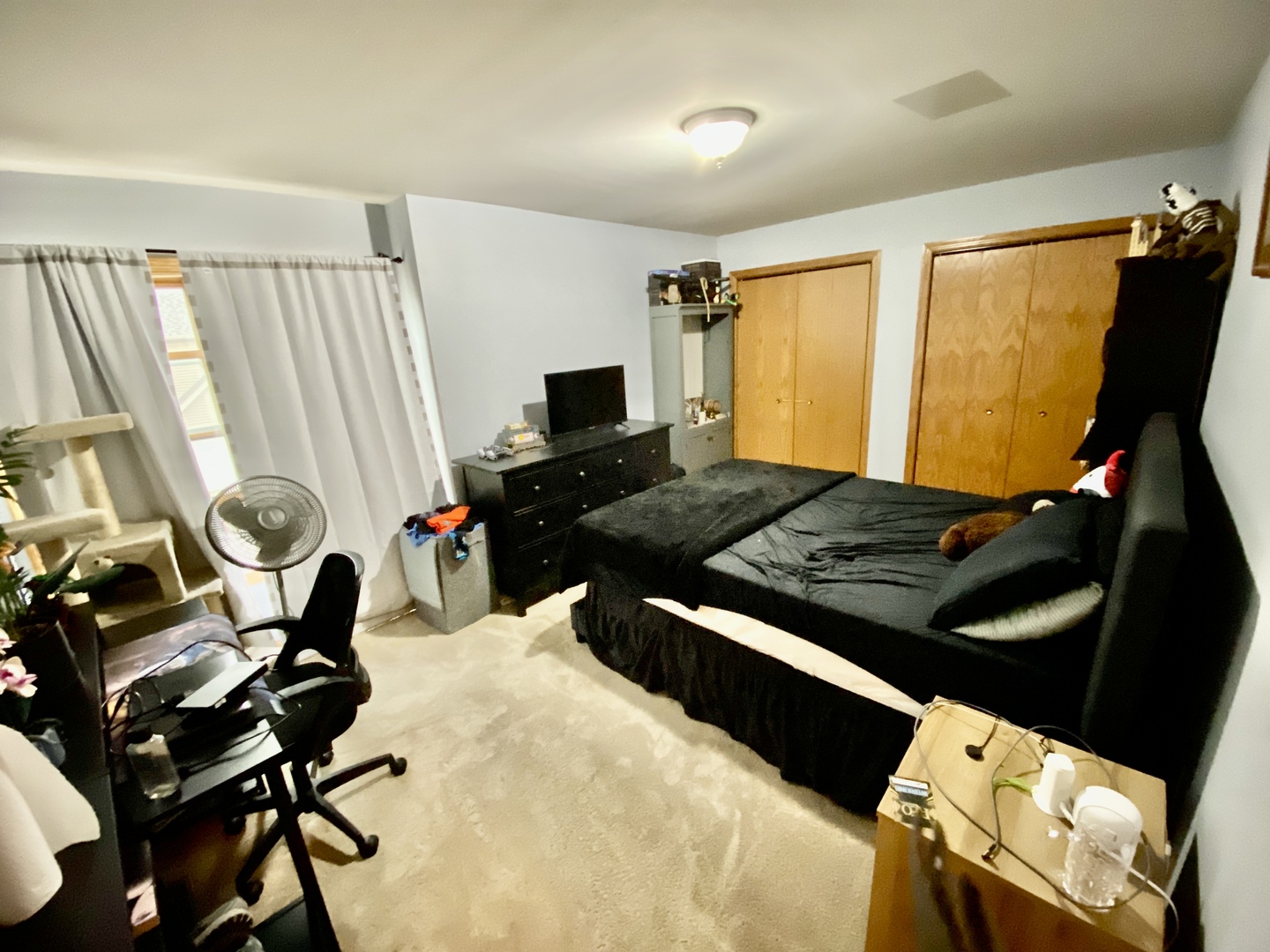 502 South Peace Road, Unit 502 Sycamore, IL 60178 - Photo 11 of 14 a living room with rug floor and a flat screen tv