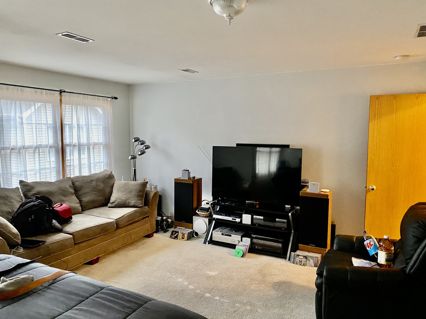 502 South Peace Road, Unit 502 Sycamore, IL 60178 - Photo 9 of 14 a living room with furniture and a flat screen tv