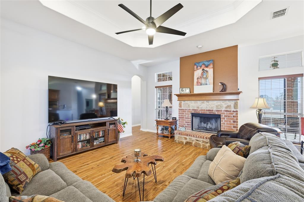 7915 Stone Ridge Drive Northlake, TX 76247 - Photo 11 of 40 a living room with furniture and a flat screen tv