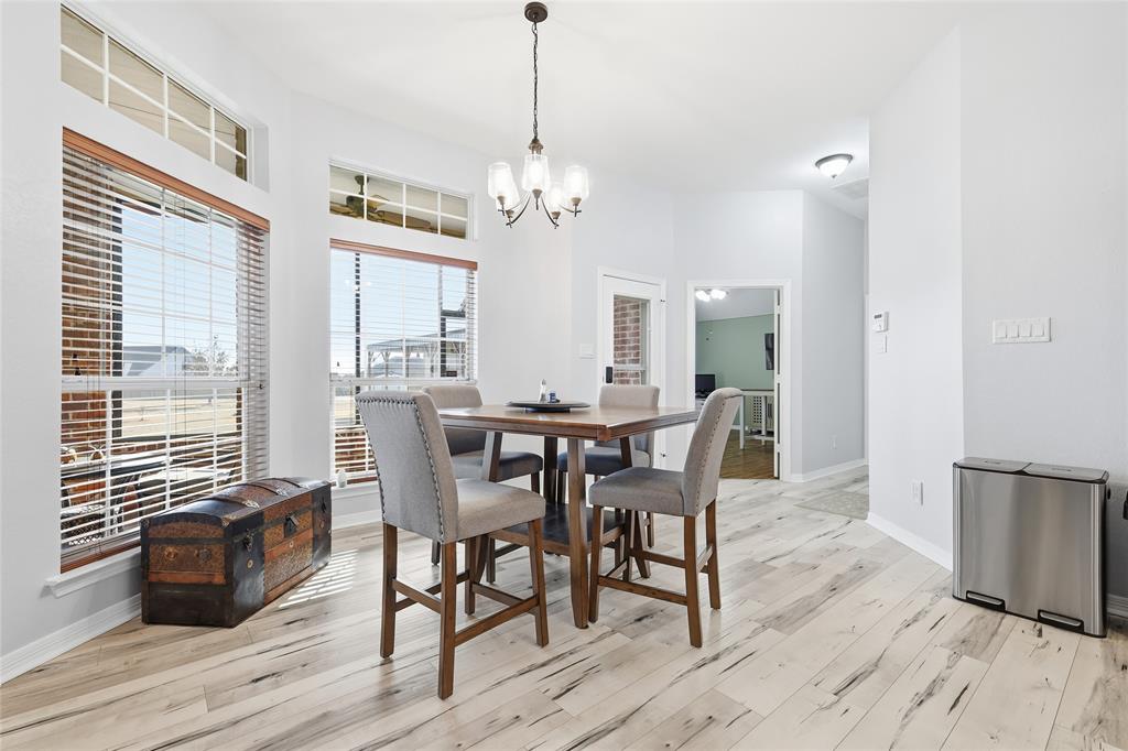 7915 Stone Ridge Drive Northlake, TX 76247 - Photo 15 of 40 a view of a dining room with furniture window and wooden floor