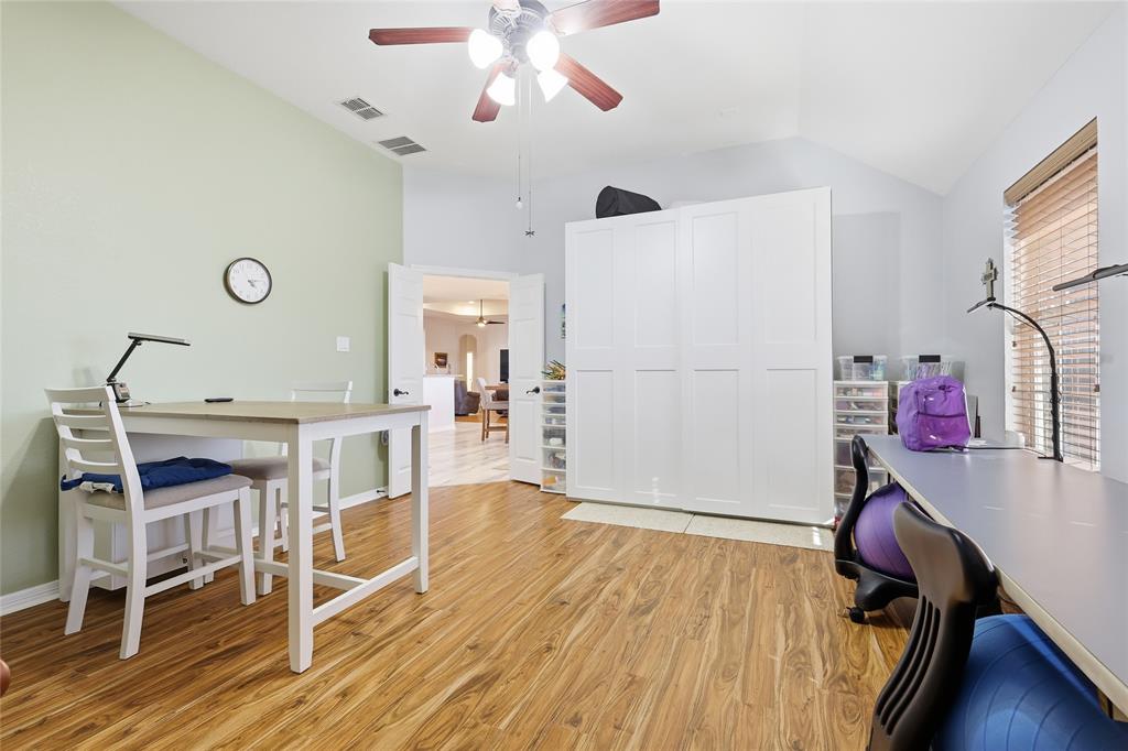 7915 Stone Ridge Drive Northlake, TX 76247 - Photo 17 of 40 a view of a dining room with furniture and wooden floor
