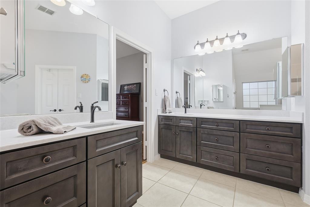 7915 Stone Ridge Drive Northlake, TX 76247 - Photo 20 of 40 a spacious bathroom with a double vanity sink double and mirror