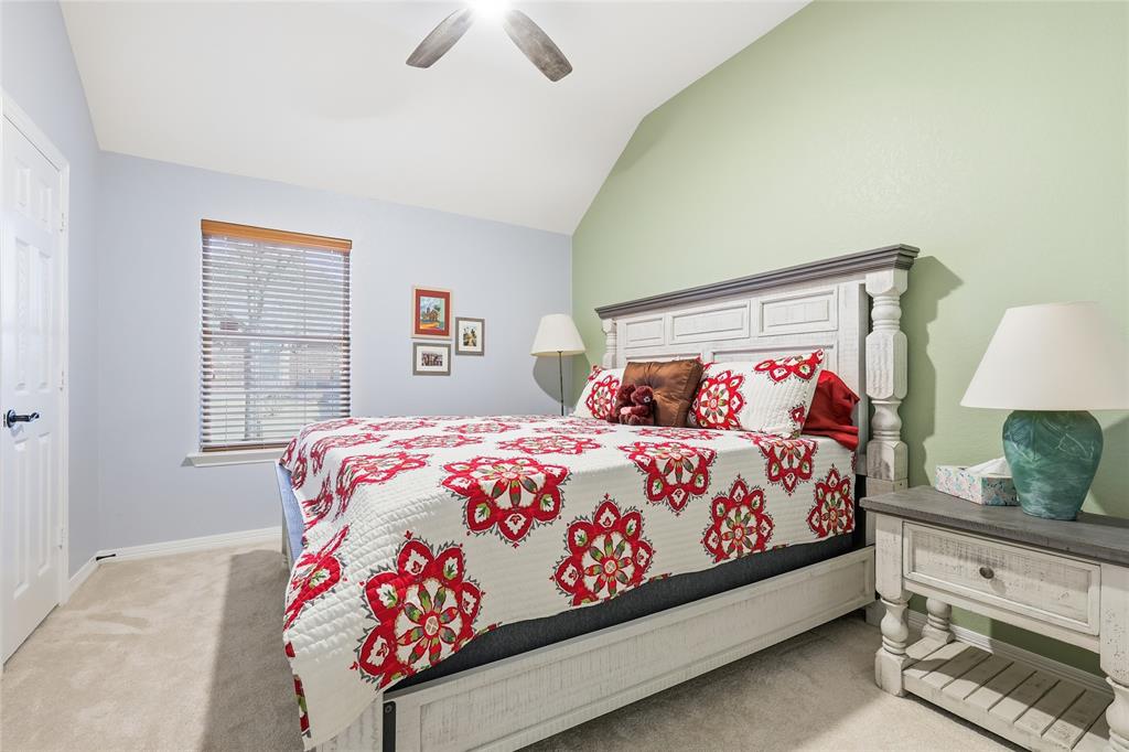 7915 Stone Ridge Drive Northlake, TX 76247 - Photo 21 of 40 a bedroom with a bed and a dresser in it